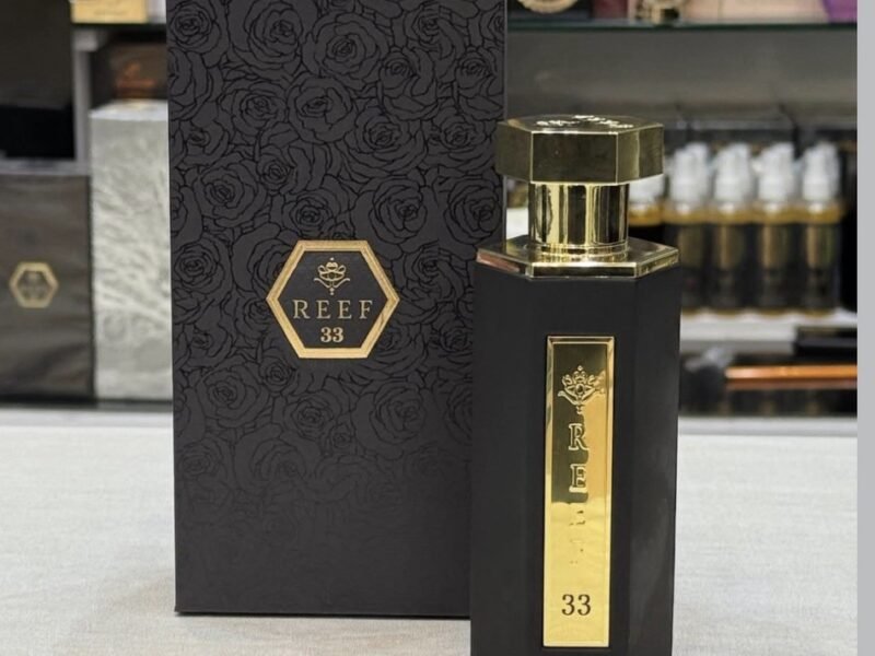 Reef perfume bottle in an elegant black and gold design